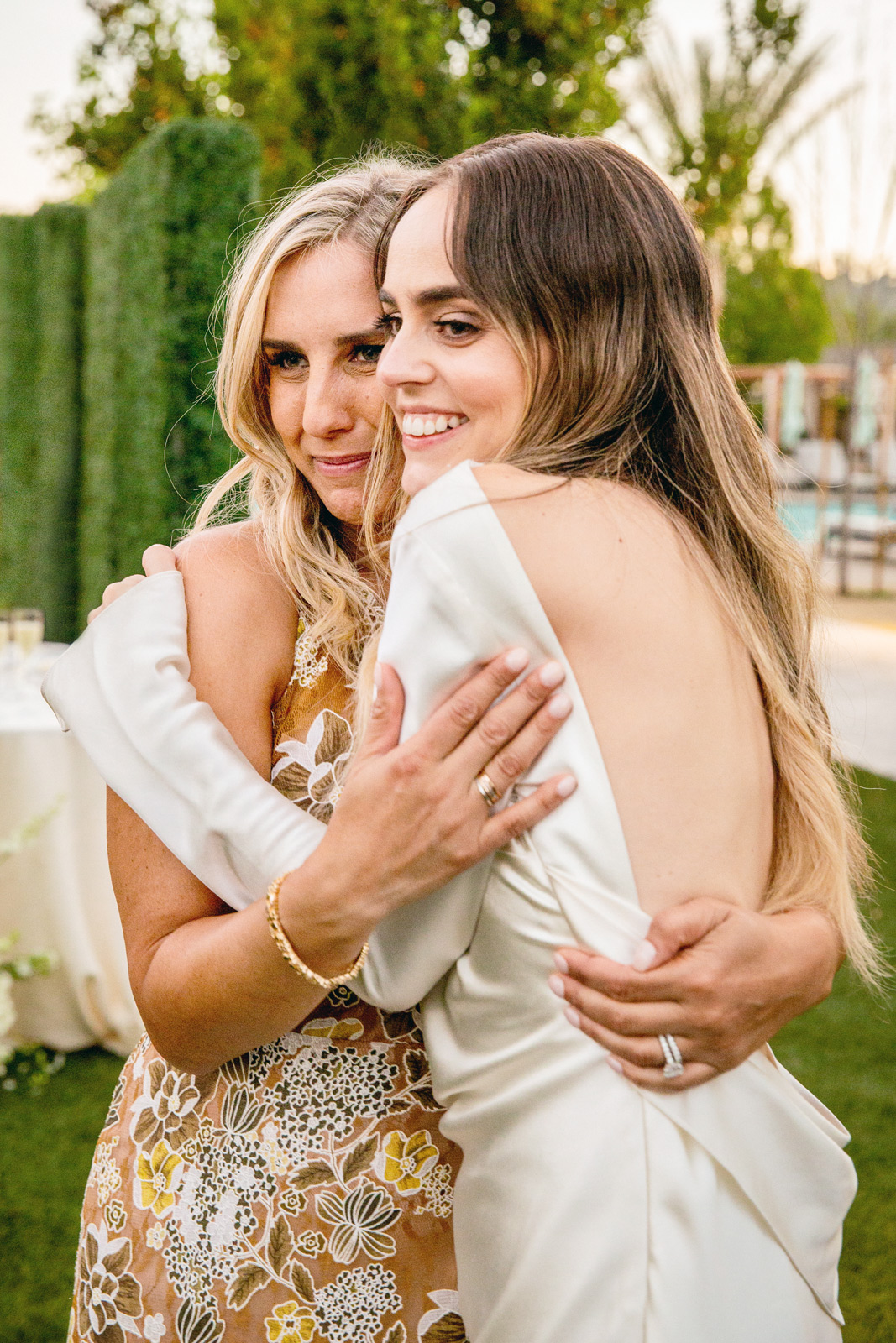 Medium shot of M hugging her new sister in law.