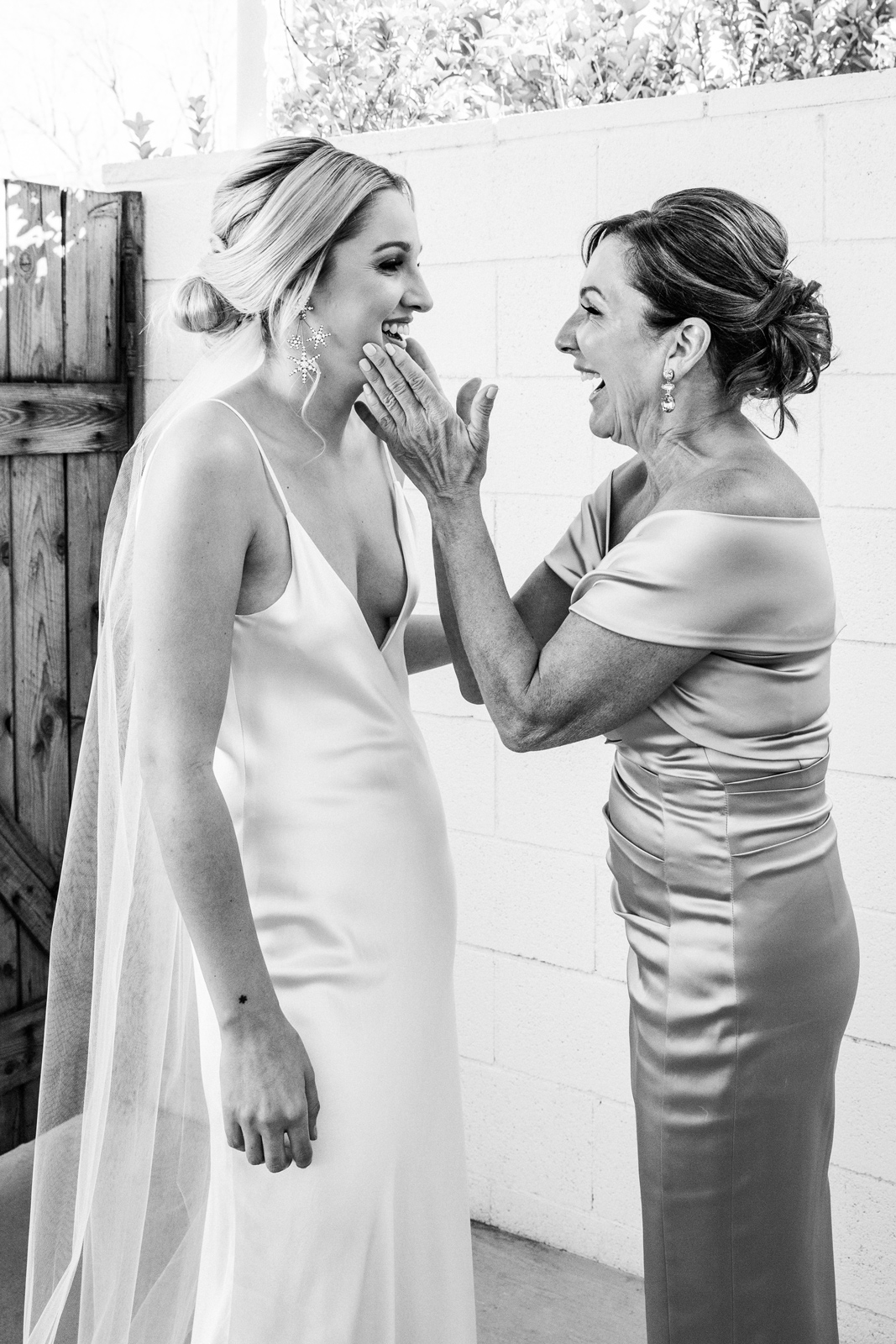 Black and white medium shot of K and her mom having an intimate moment.