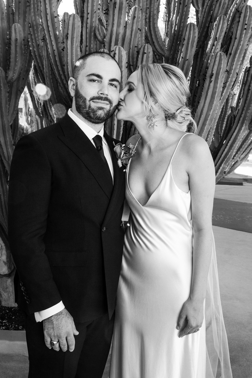 BW medium shot of K kissing B