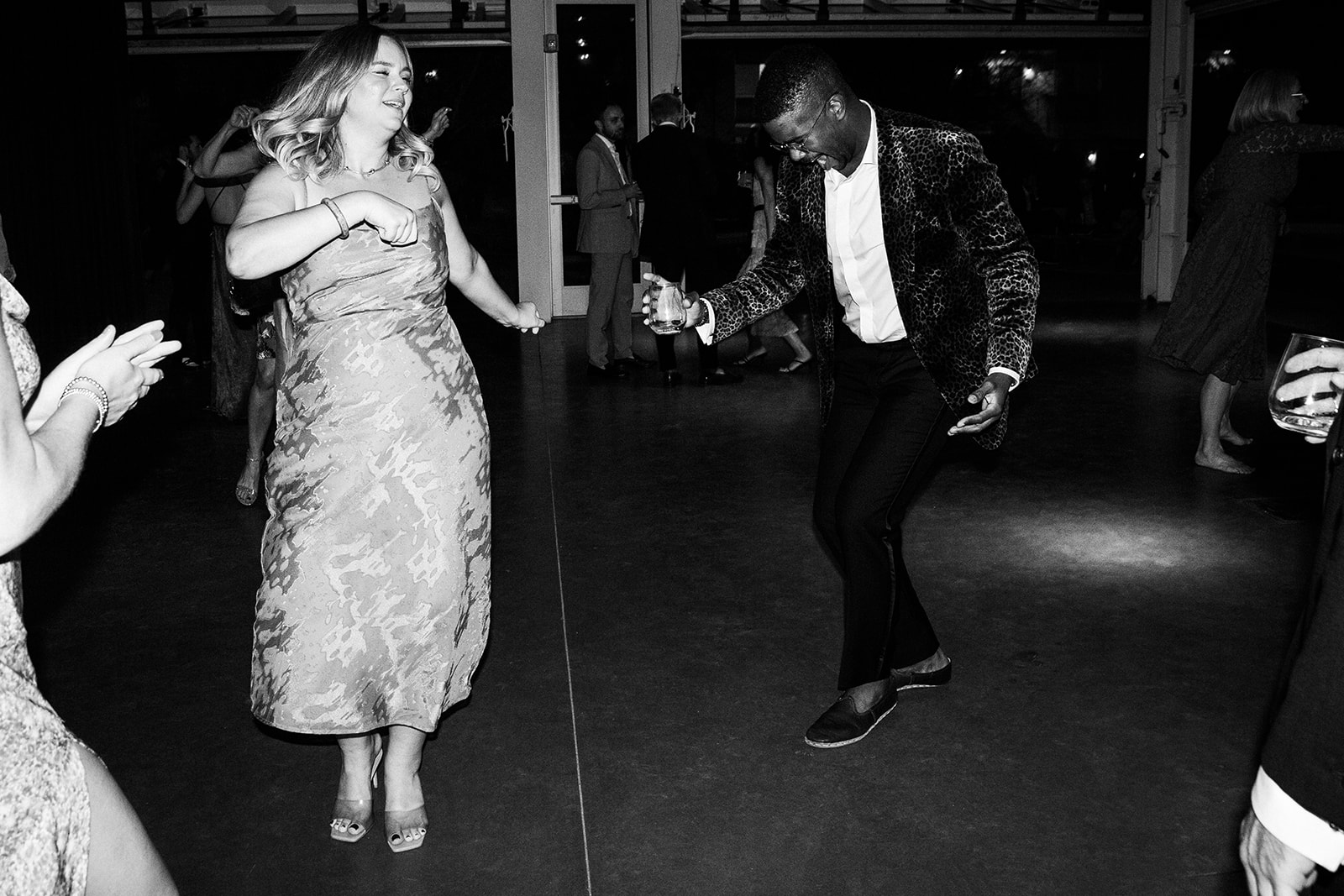 Black and white wide shot of people dancing. The music was a mellow playlist which included a mixture of 90s R&B, 70s Folk and their favorite artist, Frank Ocean all spun by DJ Paul from Dart Collective.
