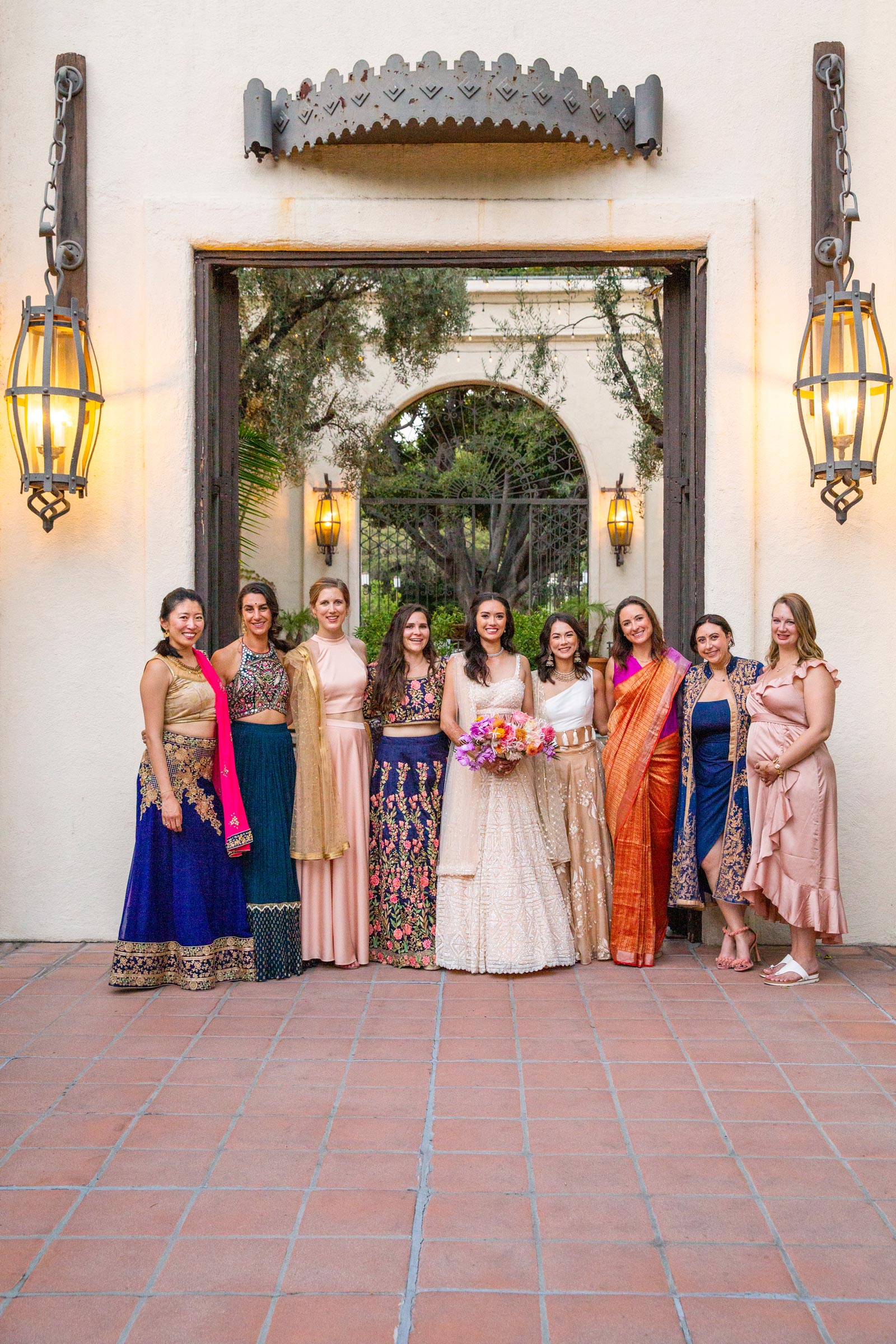 Another Wide shot of the bride standing with her bridesmaids.